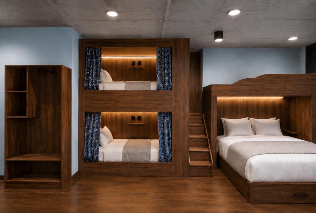 A family room with a double bed and bunks